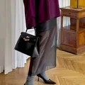 Chic and elegant black sheer high-waisted midi skirt featuring a modern perspective design - S / Bottoms / Black