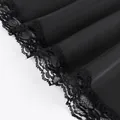 Detailed macro view showing the intricate black lace hem on smooth satin skirt fabric - S / Bottoms / Black