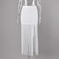 Detailed view of an elegant white long skirt featuring long fringe and a sexy side slit design - S / Bottoms / White