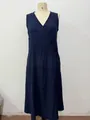 Navy blue sleeveless V-neck linen maxi dress with side button detail on mannequin - Dark Blue