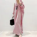 Full length view of a oversized red and white striped shirt dress for women - S / Dresses / Red