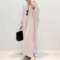 Close-up detail of a stylish oversized red and white striped maxi shirt dress for women - Pink