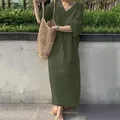 Macro view of women's loose fit dark green cotton linen maxi dress with V-neckline - S / Dresses / Green