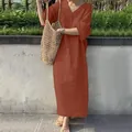 Full view of loose cotton linen V-neck maxi dress in terracotta orange on model - S / Dresses / Orange Red