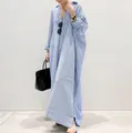 Elegant detail showing oversized blue and white striped long shirt dress with loose fit - S / Dresses / Blue