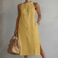 Detailed view of yellow sleeveless maxi dress with elegant lace embroidery inserts - S / Dresses / Yellow
