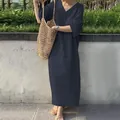 Detail view of a navy blue loose V-neck cotton linen maxi dress with casual fit and pockets - S / Dresses / Dark Blue