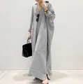 Full length detail of oversized black and white striped kaftan dress with loose fit - S / Dresses / Black