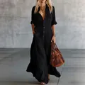 Detail of a chic long black shirt dress with buttons and pockets for elegant women - S / Dresses / Black