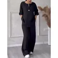 Elegant black linen-blend two-piece set featuring wide-leg pants and a button tunic - Black