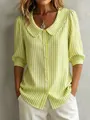 Detailed view of women's green striped shirt with Peter Pan collar and puff sleeves - S / Tops / Yellow-Green