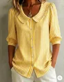 Close-up detail of Peter Pan collar and puff sleeves on a yellow striped commute shirt - Yellow