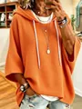 Primer plano de sudadera naranja con capucha de punto gofre y cordón blanco ajustable - S / Tops / Naranja