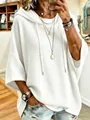 Vista detallada de cerca de la sudadera blanca oversize de punto de gofre para mujer - S / Tops / Blanco