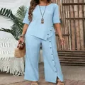 Elegant light blue two-piece set with irregular hem top and button-detail wide-leg pants - Light Blue
