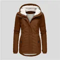 Detailed view of a brown women's hooded winter jacket featuring warm white fleece lining - S / Caramel color