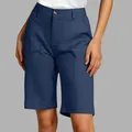 Detail of navy blue high-waisted bermuda shorts for women in a professional studio shot. - Navy Blue