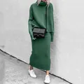 Street style shot of a woman in a green knitted turtleneck sweater and skirt set. - S / Top And Bottom / Green
