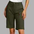 Detail view of high-waisted olive green Bermuda shorts with front pockets and seam lines. - Army Green