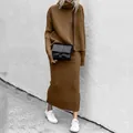 Close-up of brown ribbed knit two-piece set featuring turtleneck sweater and long skirt - Brown