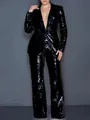 Detailed view of women's shimmering black sequined two-piece blazer and trousers suit - Black