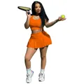 Ensemble de sport orange avec débardeur ajusté et jupe de tennis plissée pour femme - Orange