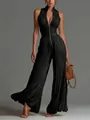 Detail shot of black pleated sleeveless wide-leg jumpsuit with deep V-neck and zipper - XS / Jumpsuits / Black