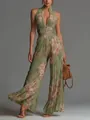 Detailed view of green floral pleated wide-leg jumpsuit with stylish front zipper - XS / Jumpsuits / Green