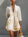 Detail of a white cotton-linen dress with gold abstract print and delicate lace trim. - S / Dresses / White