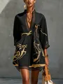 Close-up of black V-neck vacation dress with gold abstract print and lace trim details - S / Dresses / Black