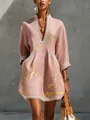 Detail of pink V-neck dress with gold abstract print and elegant white lace trim. - S / Dresses / Pink