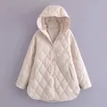 Professional full view of light beige hooded quilted jacket with classic diamond pattern - XS / Tops / Silver Gray