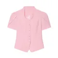 Detail of pink short-sleeved blazer featuring a lace neckline and puff sleeves. - Pink