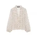Elegant white ruffled chiffon blouse featuring brown polka dots and front ruffle detail - Printing