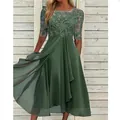 Detail of green lace patchwork chiffon evening gown with elegant floral embroidery - S / Dresses / Green