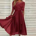 Close-up detail of wine red evening dress with lace bodice and chiffon skirt on model - S / Dresses / Burgundy