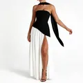 Elegant black and white strapless evening dress with high slit and long ribbon scarf detail. - Black and White