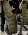 Side view detail of a women's long hooded quilted puffer vest in olive green color - Army Green