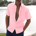 Detail shot of a pink men's casual beach shirt featuring a linen-like texture and buttons - S / Tops / Pink