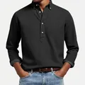 Close-up view of a black textured long-sleeved polo shirt with white buttons for men - Black