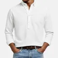Detailed view of a white textured long-sleeve polo shirt showing the button-down collar - S / Tops / White