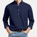 Detail view of men's navy blue long sleeve polo shirt with textured jacquard fabric - S / Tops / Dark Blue