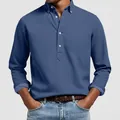 Men's blue long-sleeve textured polo shirt with jacquard pattern and button collar. - S / Tops / Sapphire Blue