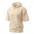 Gros plan d'un t-shirt à capuche en lin beige avec une texture naturelle premium - S / Hauts / Abricot