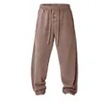 Comfortable men's waffle knit lounge pants featuring a drawstring waist in dusty rose color - Khaki
