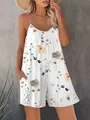 Stylish women's floral sleeveless romper featuring spaghetti straps and pockets - S / White