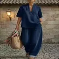 Completo minimalista blu scuro con maglia scollo a V e pantaloni larghi da donna. - Taglia S / Top E Pantaloni / Blu scuro