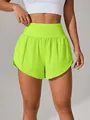 Front view of lime green high-waisted quick-dry sports shorts for yoga and fitness - S / Bottoms / Fluorescent Green