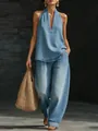 Mannequin portant un ensemble d'été en denim délavé avec haut dos nu et pantalon large. - S / Haut et bas / Bleu clair