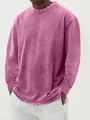 Detailopname van een vintage heren-T-shirt met lange mouwen van katoen en acid-wash - Roze